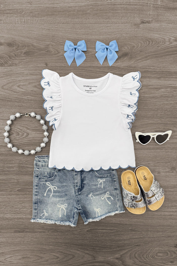 White & Blue Bow Denim Short Set - 6-12 Months - White scalloped-edge sleeveless top with ruffled armholes, distressed denim shorts, blue bow hair clips, beaded bracelet,.