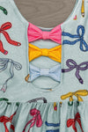 Mint Glitter School Bows Dress - 3T - Mint dress with colorful glitter bow prints and three fabric bows in pink, yellow, and striped blue at the neckline.