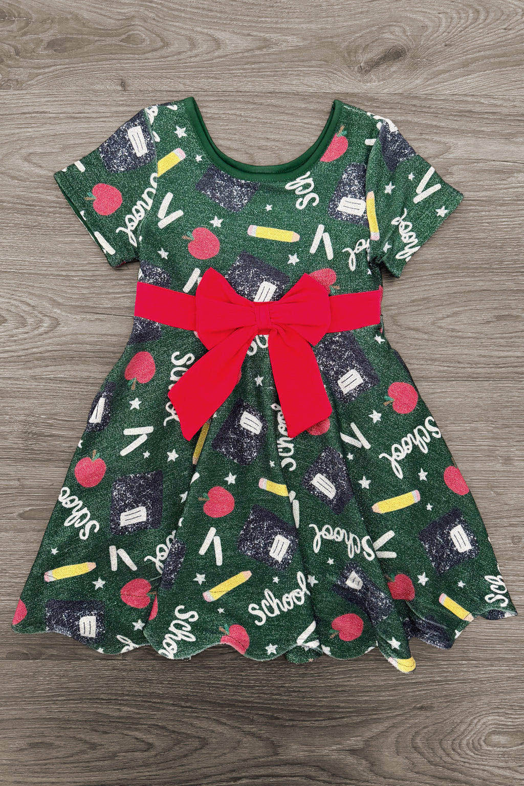 Green Glitter School Supplies Dress - 3T - Green glitter dress with school supplies print, short sleeves, and red bow belt.