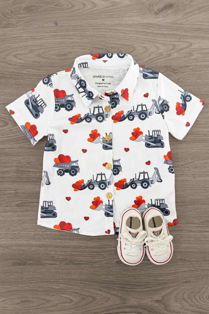 Tractor & Hearts Button Down - 3XS-6-12 Months - White short-sleeve button-down shirt with gray tractors and red heart patterns, paired with white toddler sneakers.