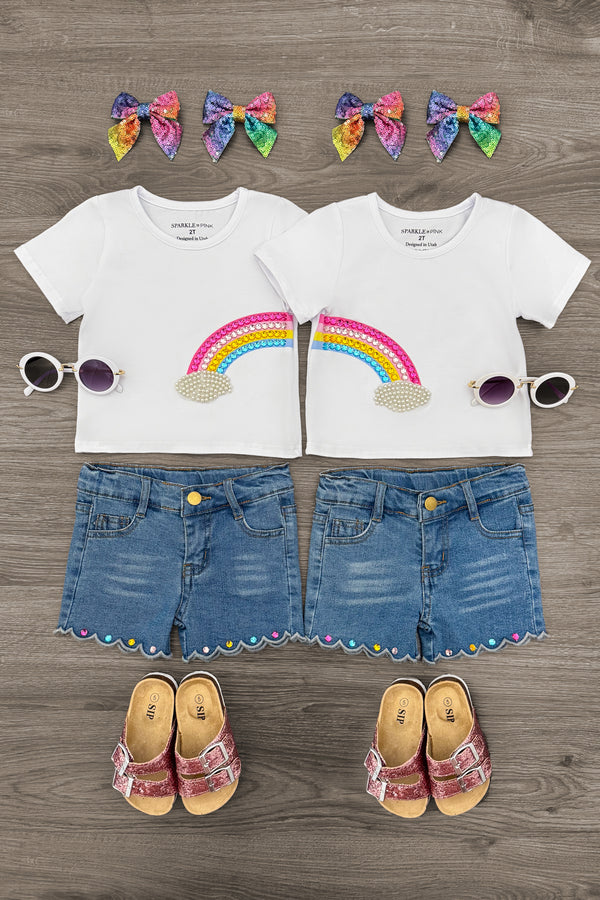 Gemstone Rainbow Denim Short Set - Left Side / 6-12 Months - White toddler t-shirts with rainbow graphic, denim shorts with gemstone rainbow trim, rainbow bow headbands, white.