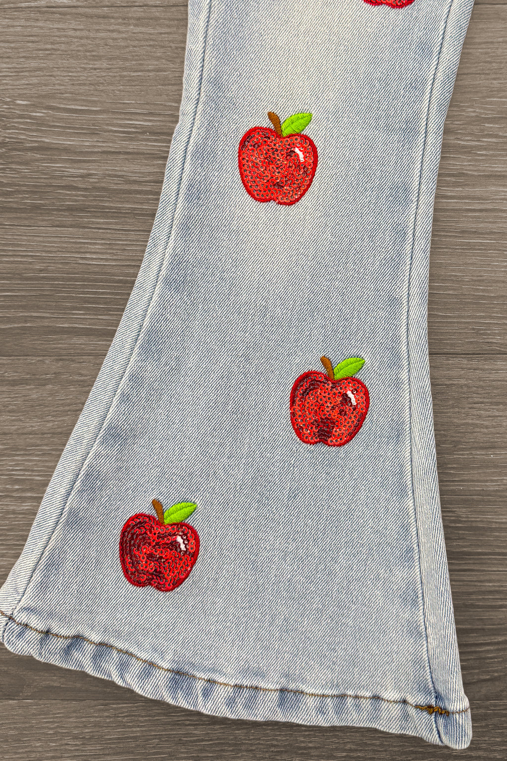Red Apple Flare Denim Pant Set - 3T - Light blue denim flare pant leg with red apple embroidery scattered down the leg.