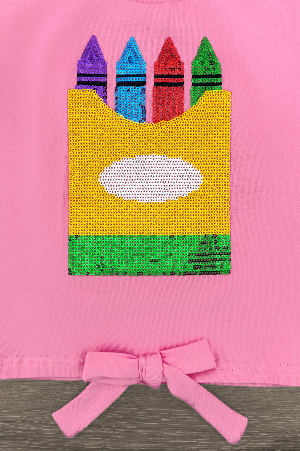 Pink Sequin Crayon Denim Short Set - 3T - Pink fabric with a colorful sequin crayons box graphic and a pink bow tied at the hem.