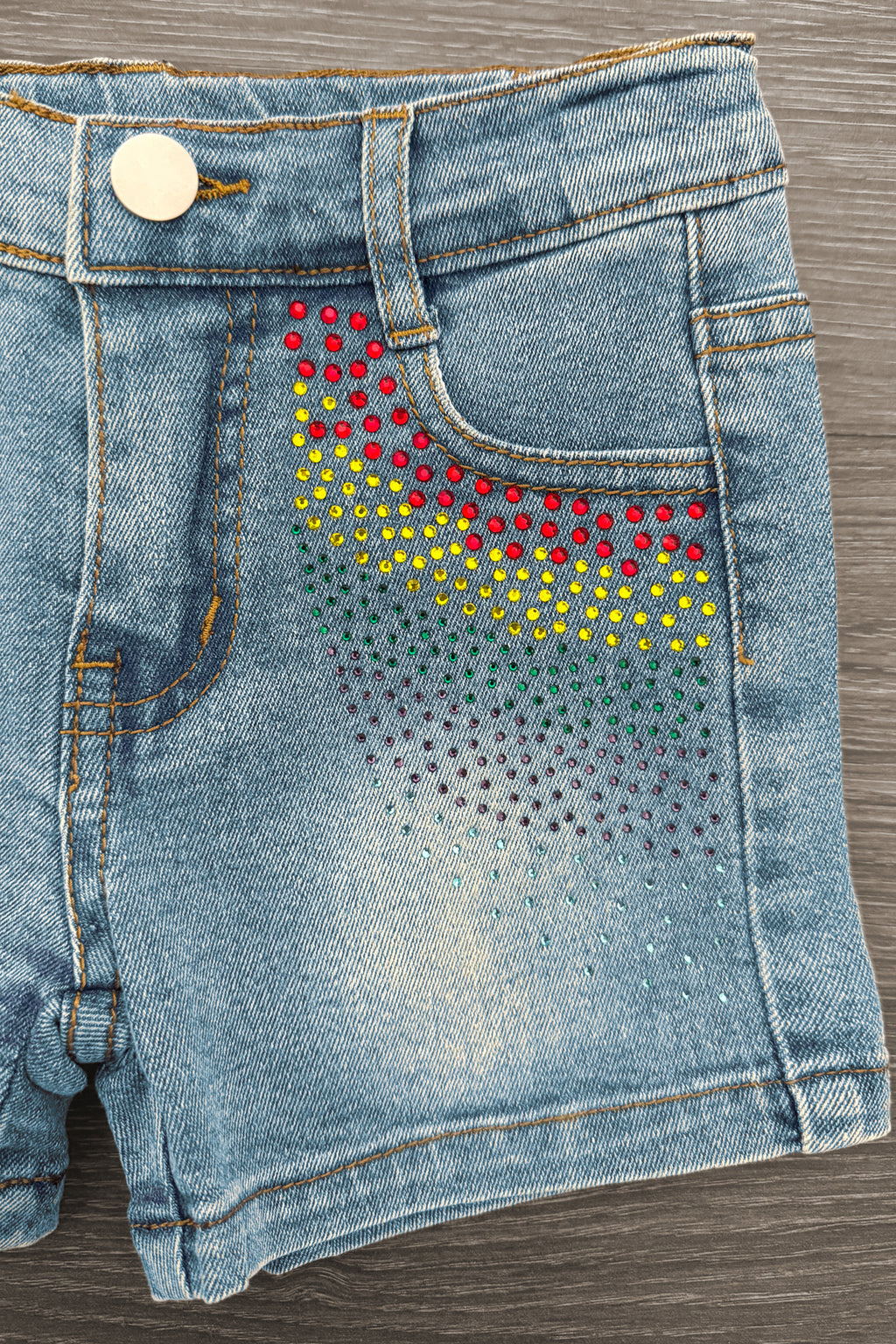 Pink Sequin Crayon Denim Short Set - 3T - Light blue denim shorts with pink, yellow, and black sequins arranged in curved stripes near front pocket.