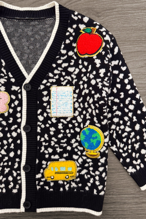 Mom & Me - Composition Sweater Cardigan - CHILD-3T - Black knit cardigan with white speckled pattern and colorful educational patches including apple, flower, notebook, globe,.