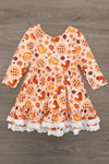 Autumn Pie Ruffle Dress - 6-12 Months - Orange long-sleeve dress with autumn-themed print, ruffled skirt, and white lace trim.
