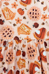 Autumn Pie Ruffle Dress - 6-12 Months - Orange and cream dress fabric with autumn-themed pie, pumpkin, and leaf print and ruffle detail at waist.