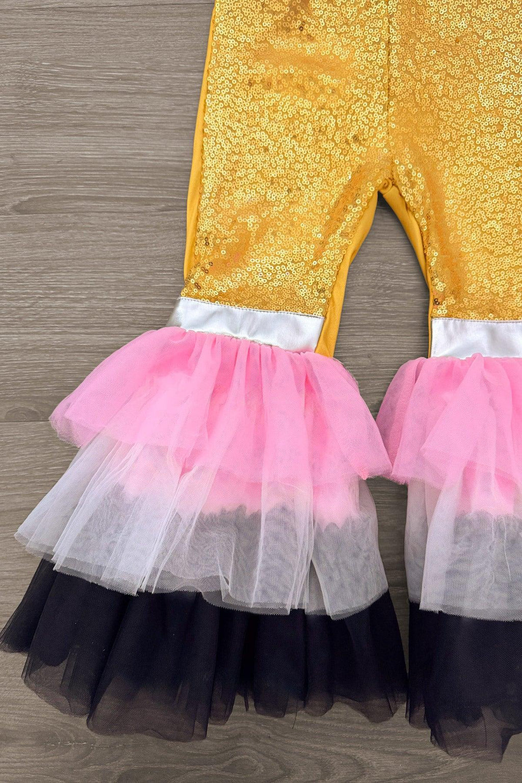 "Little Miss Rule The School" Bell Bottom Set - 3T - Gold textured bell bottom pants with layered pink, white, and black tulle ruffles at the cuffs.