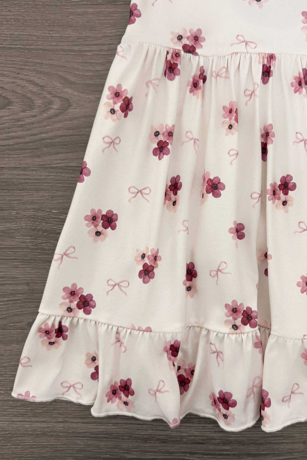 Pink Flowers & Bows Dress - 6-12 Months - White dress with pink and purple floral print, small bows, and ruffled hem.