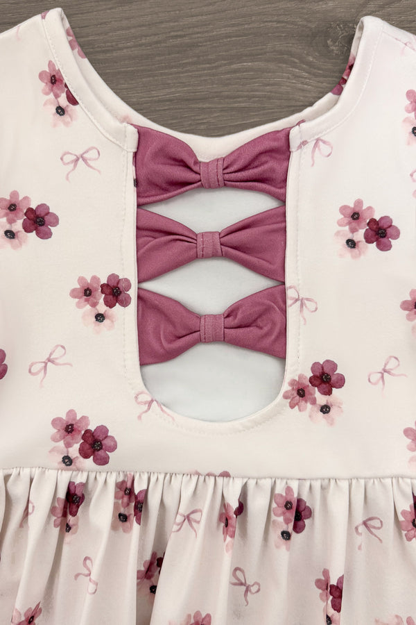 Pink Flowers & Bows Dress - 6-12 Months - Light pink dress with small purple floral prints and three mauve fabric bows on the chest cutout.