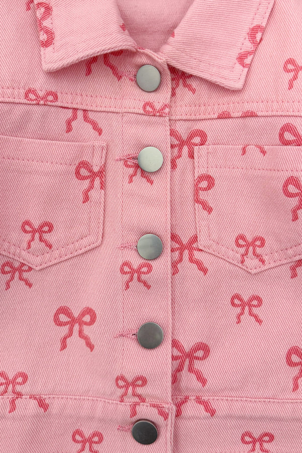 Pink Bow Denim Jacket - 6-12 Months - Pink denim jacket with all-over small bow print, snap buttons, and front chest pockets.