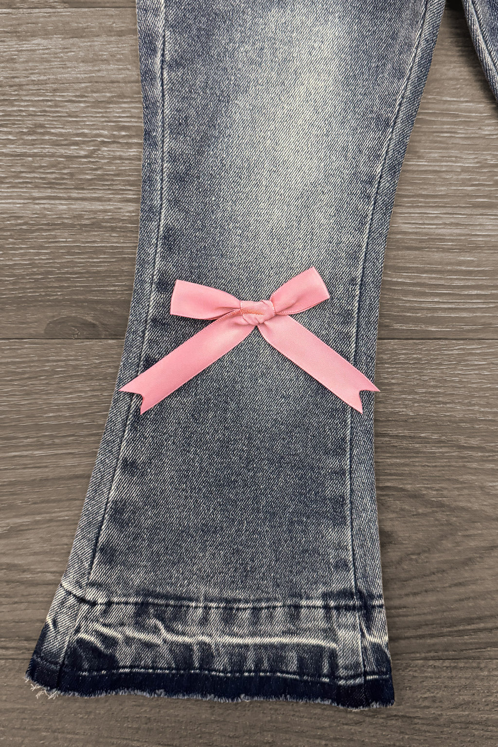 Pink Bow Denim Flare Pant Set - 6-12 Months - Light-wash denim flare pant leg with frayed hem and pink bow detail near ankle.