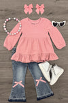 Pink Bow Denim Flare Pant Set - 6-12 Months - Pink long-sleeve ruffle hem top paired with denim flare pants featuring pink bows at the knees, accessorized with pink hair.