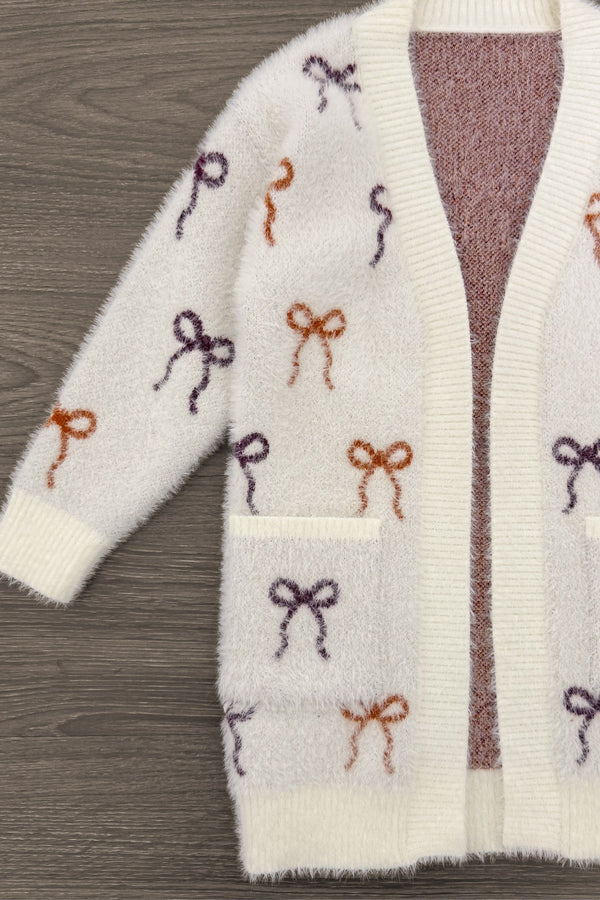 Mom & Me - Cozy Cream Bow Cardigan - CHILD-6-12 Months - Cream knit cardigan with burgundy and rust bow patterns and front patch pocket.