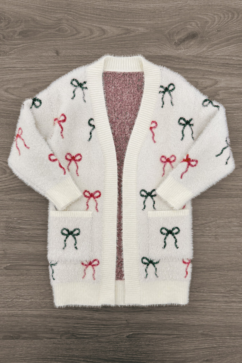 Mom & Me - Cozy Red & Green Bow Cardigan - CHILD-6-12 Months - Cream cardigan with red and green bow patterns, open front, long sleeves, and two front pockets.