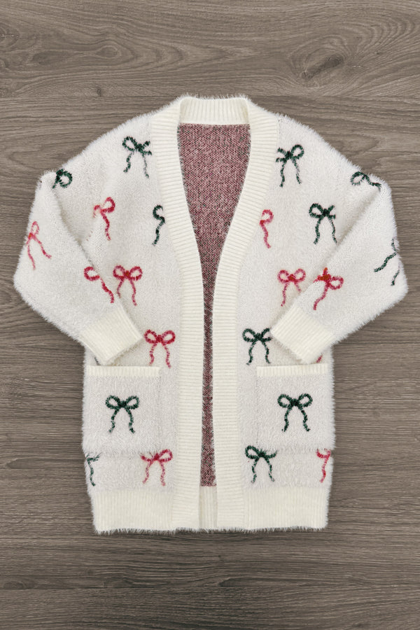 Mom & Me - Cozy Red & Green Bow Cardigan - CHILD-6-12 Months - Cream cardigan with red and green bow patterns, open front, long sleeves, and two front pockets.