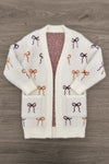 Mom & Me - Cozy Cream Bow Cardigan - CHILD-6-12 Months - Cream knit cardigan with multicolored bow patterns in brown, burgundy, and rust, featuring front pockets and an open front.
