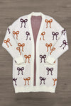 Mom & Me - Cozy Cream Bow Cardigan - MOM-XS - Cream knit cardigan with burgundy and rust bow patterns, open front design.