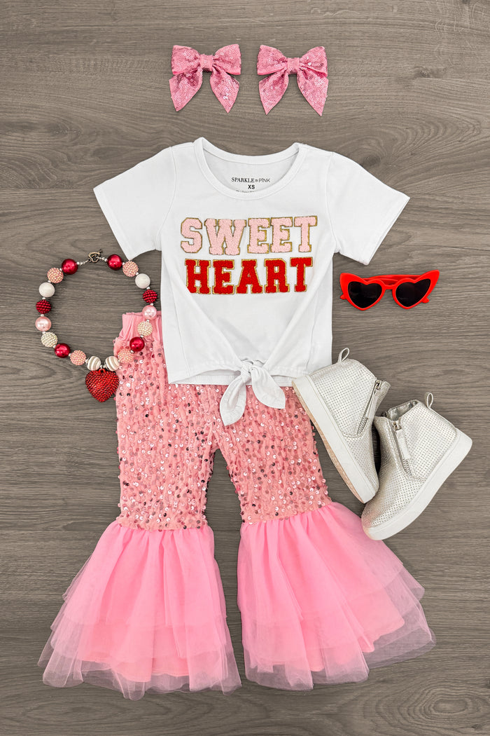 "Sweet Heart" Pink Sequin Bell Bottom Set - 3XS-6-12 Months - White tied crop top with "Sweet Heart" text, pink sequin bell bottom pants, pink bow clips, red heart-shaped sunglasses,.