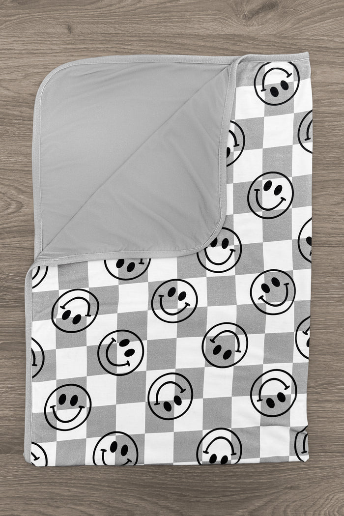 Bamboo Smiley Days Double Sided Blanket - Default Title - Gray and white double-sided bamboo blanket with smiley face and checkered pattern.