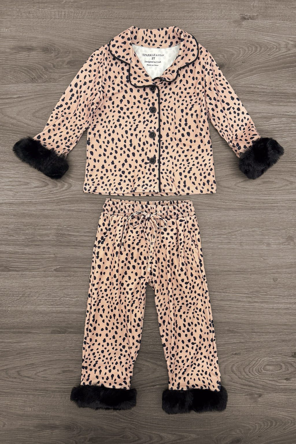 Mom & Me - Fuzzy Cheetah Waffle Knit Pajamas - CHILD-6-12 Months - Brown fuzzy cheetah print waffle knit pajama set with black faux fur trim on cuffs and pant hems.