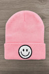 Smiley Face Beanies - Pink - Pink knitted beanie hat with folded cuff and black-and-white embroidered smiley face on front.