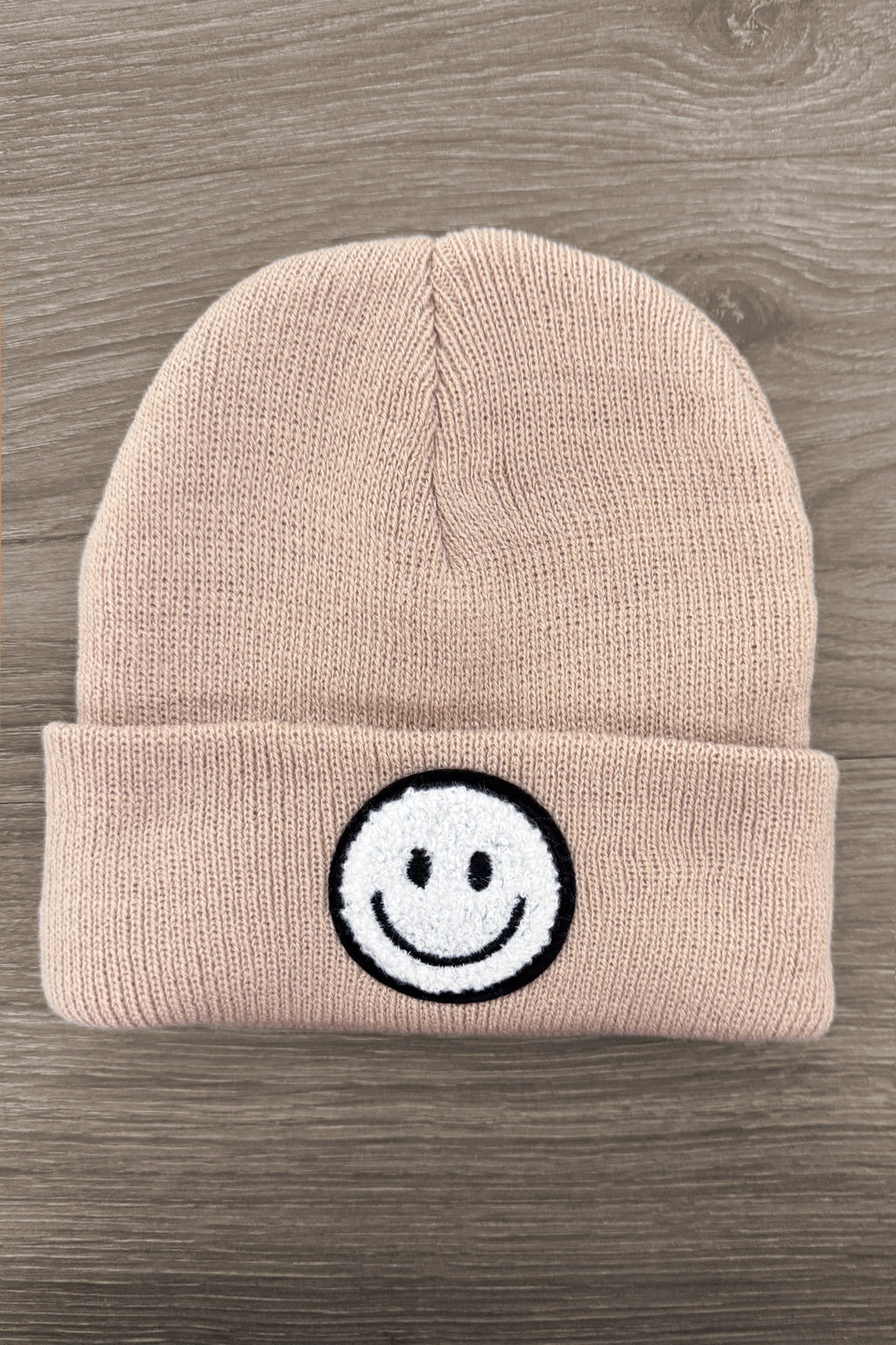 Smiley Face Beanies - Tan - Tan knit beanie with folded cuff featuring a black and white smiley face patch at center front.