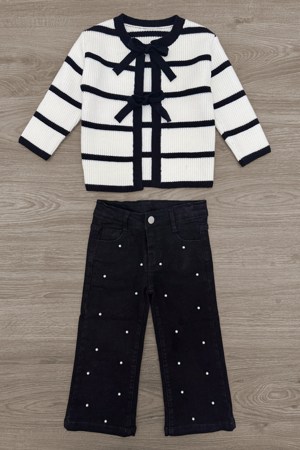 Striped Sweater Cardigan Denim Pant Set - 6-12 Months - White and black striped knit cardigan with bow ties paired with black wide-leg denim pants embellished with small pearls.