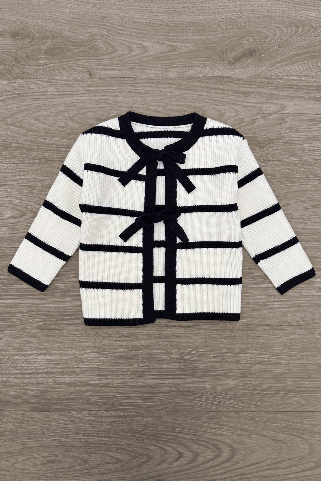 Striped Sweater Cardigan Denim Pant Set - 6-12 Months - White cardigan with black horizontal stripes and black trim, featuring front bow ties and a chest pocket.