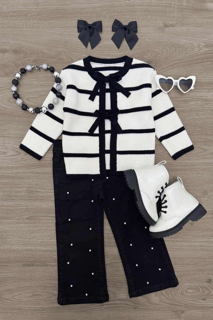 Striped Sweater Cardigan Denim Pant Set - 6-12 Months - Black and white striped knit cardigan with bow details, black wide-leg pants with pearl accents, white lace-up boots, black.