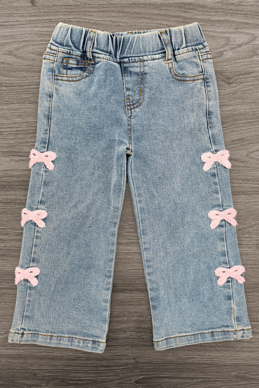 Pink Chenille Bow Denim Pants - 3-6 Months - Light blue denim pants with an elastic waistband and pink chenille bows down the sides.