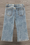 Gemstone Denim Pants - 6-12 Months - Light blue denim pants with a slightly flared leg and two back pockets featuring gemstone embellishments on a wooden floor.
