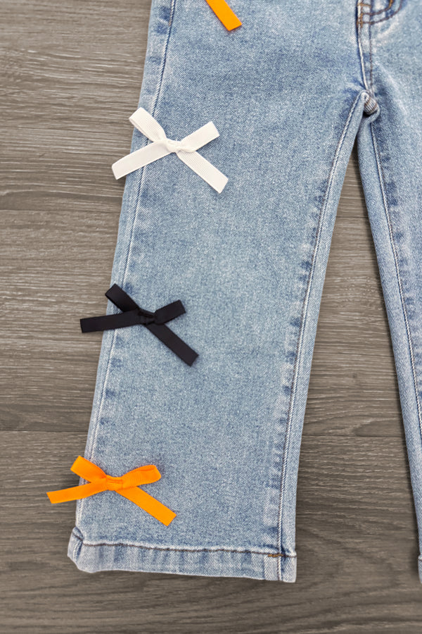 "Spooky Season" Bow Denim Pant Set - 6-12 Months - Light blue denim pants with white, black, and orange bows vertically aligned on the pant leg.