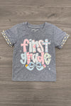 "Pre-K - Sixth Grade" Plaid Bow Denim Short Set - PRE-K / 2T - Gray short-sleeve t-shirt with plaid bow print and colorful "first grade" lettering, plaid sleeve cuffs.