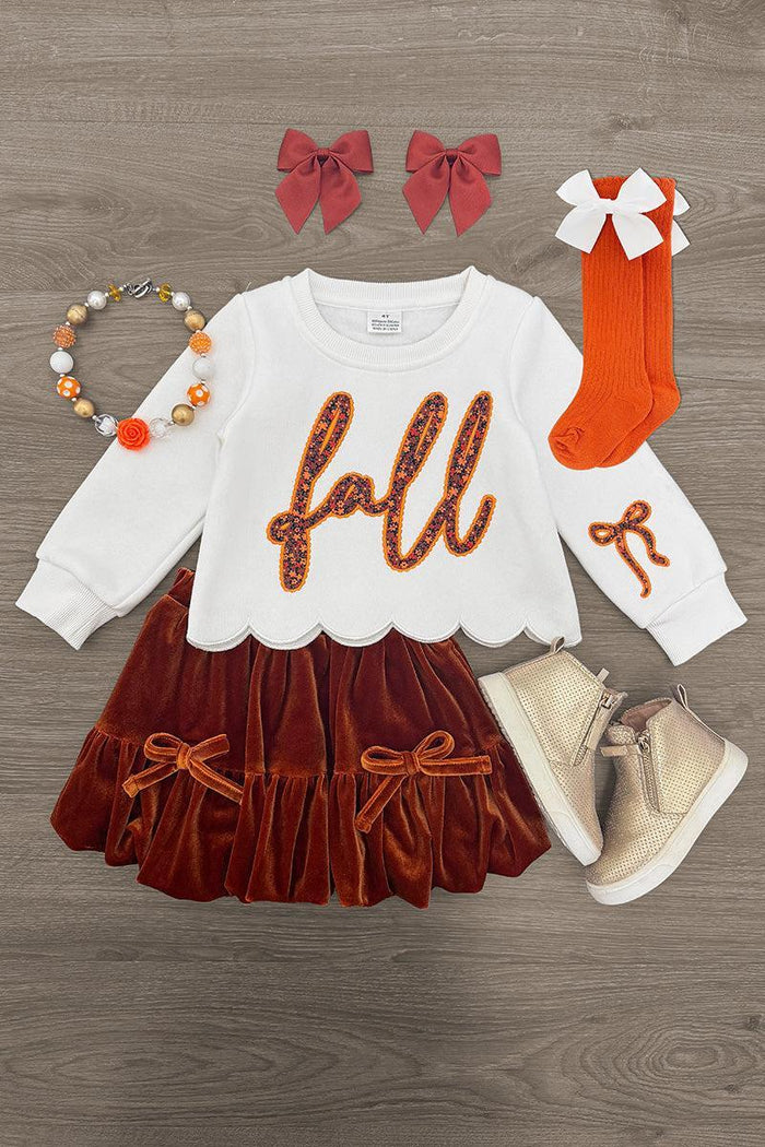 "Fall" Rust Floral Suede Skirt Set - 6-12 Months - Cream long-sleeve top with scalloped hem and rust floral "fall" text paired with rust velvet skirt featuring bow accents.