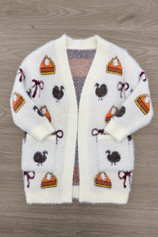 Mom & Me - Cozy Thanksgiving Cardigan - CHILD-6-12 Months - Cream-colored fuzzy cardigan with Thanksgiving-themed patches including pumpkin pie slices, turkeys, and candy canes,.