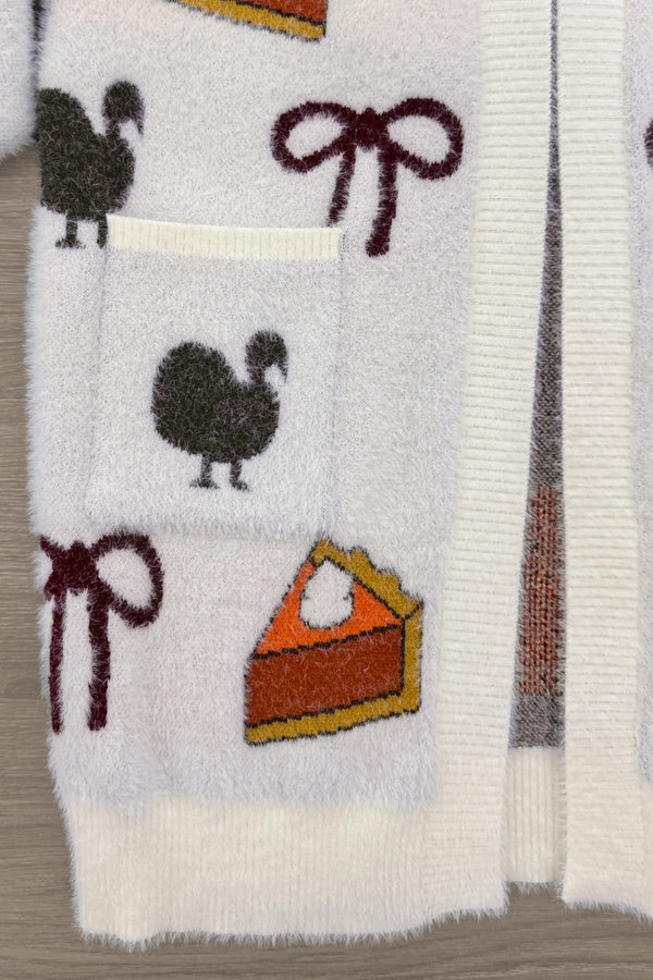 Mom & Me - Cozy Thanksgiving Cardigan - CHILD-6-12 Months - Cream knit cardigan with turkey, bow, and pumpkin pie patterns in warm fall colors.