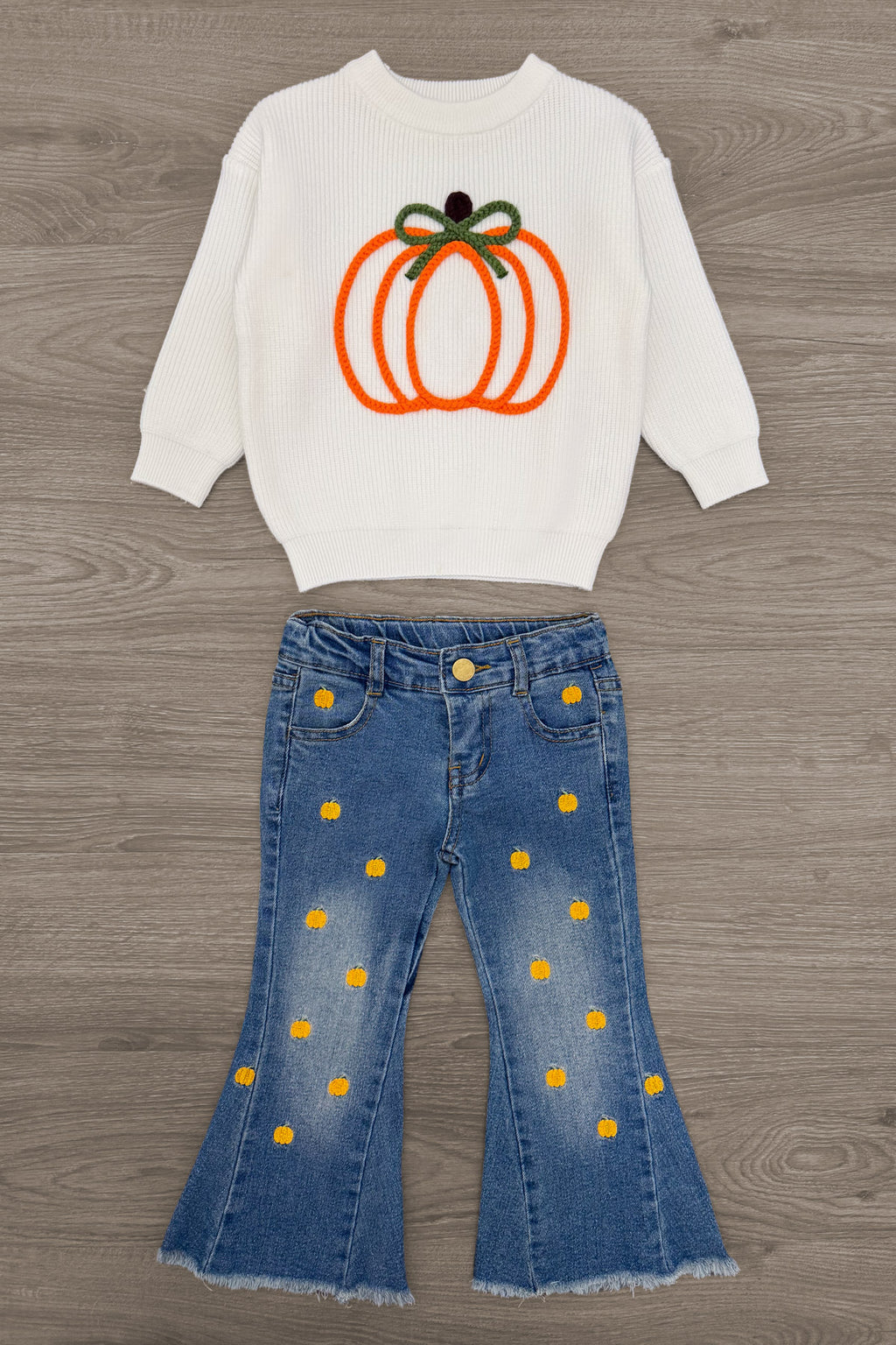 Pumpkin Denim Flare Set - 6-12 Months - Cream sweatshirt with orange pumpkin graphic and green bow, paired with blue denim flare jeans with yellow polka dots.