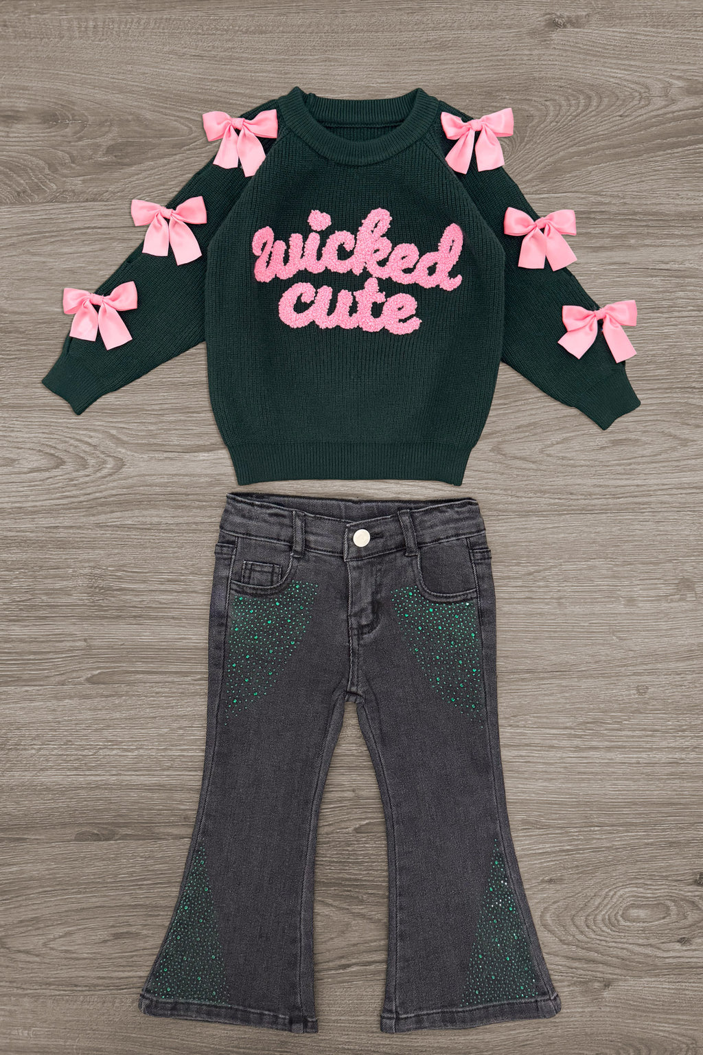"Wicked Cute" Denim Flare Set - 6-12 Months - Black long-sleeve sweatshirt with pink "wicked cute" text and pink bows on sleeves paired with black denim flare pants.