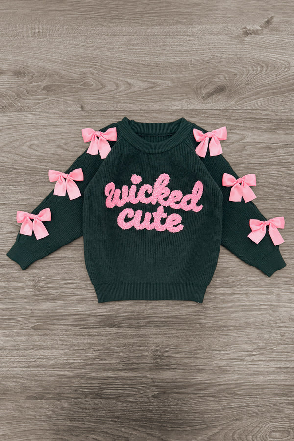 "Wicked Cute" Denim Flare Set - 6-12 Months - Black long-sleeve sweatshirt with pink "wicked cute" text and pink bows on sleeves, laid flat on wood floor.