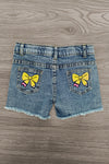 "Pre-K - Sixth Grade" Pink Pearl Denim Short Set - PRE-K / 2T - Child's denim shorts with frayed hems, featuring two back pockets each adorned with a yellow bow graphic print.