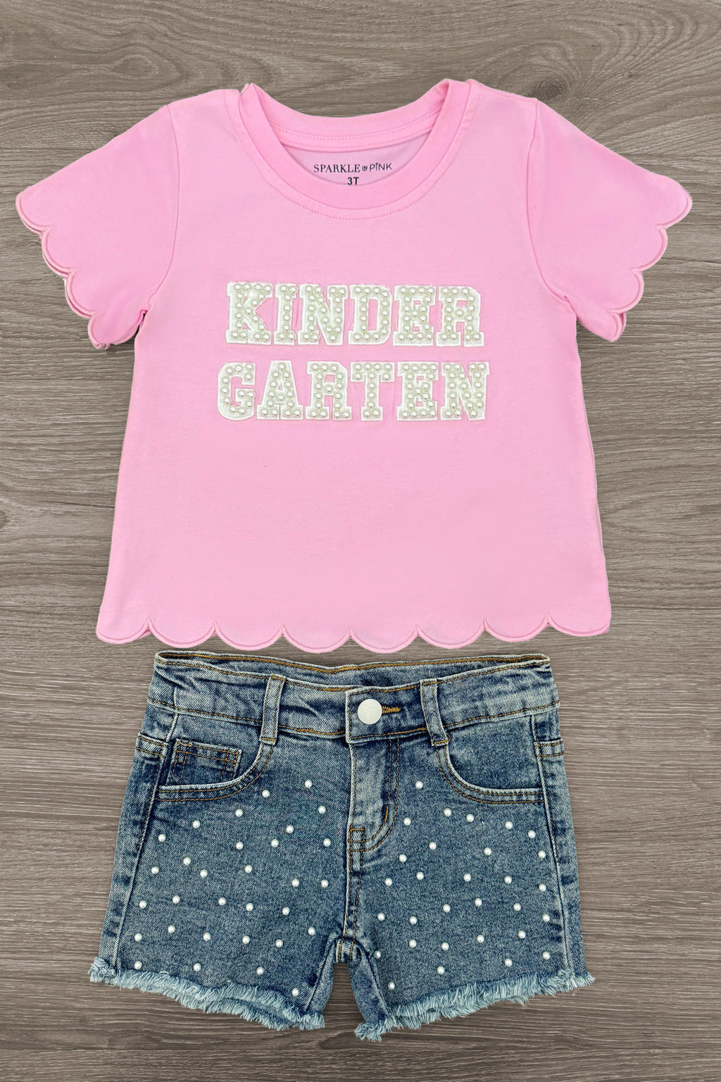 "Pre-K - Sixth Grade" Pink Pearl Denim Short Set - PRE-K / 2T - Pink short sleeve t-shirt with scalloped hem and "KINDER GARTEN" text paired with blue denim shorts embellished with silver.