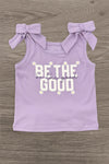 "Be The Good" Daisy Denim Skirt Set - 6-12 Months - Light purple sleeveless top with bow ties on shoulders and "Be The Good" text with daisies in white and yellow.