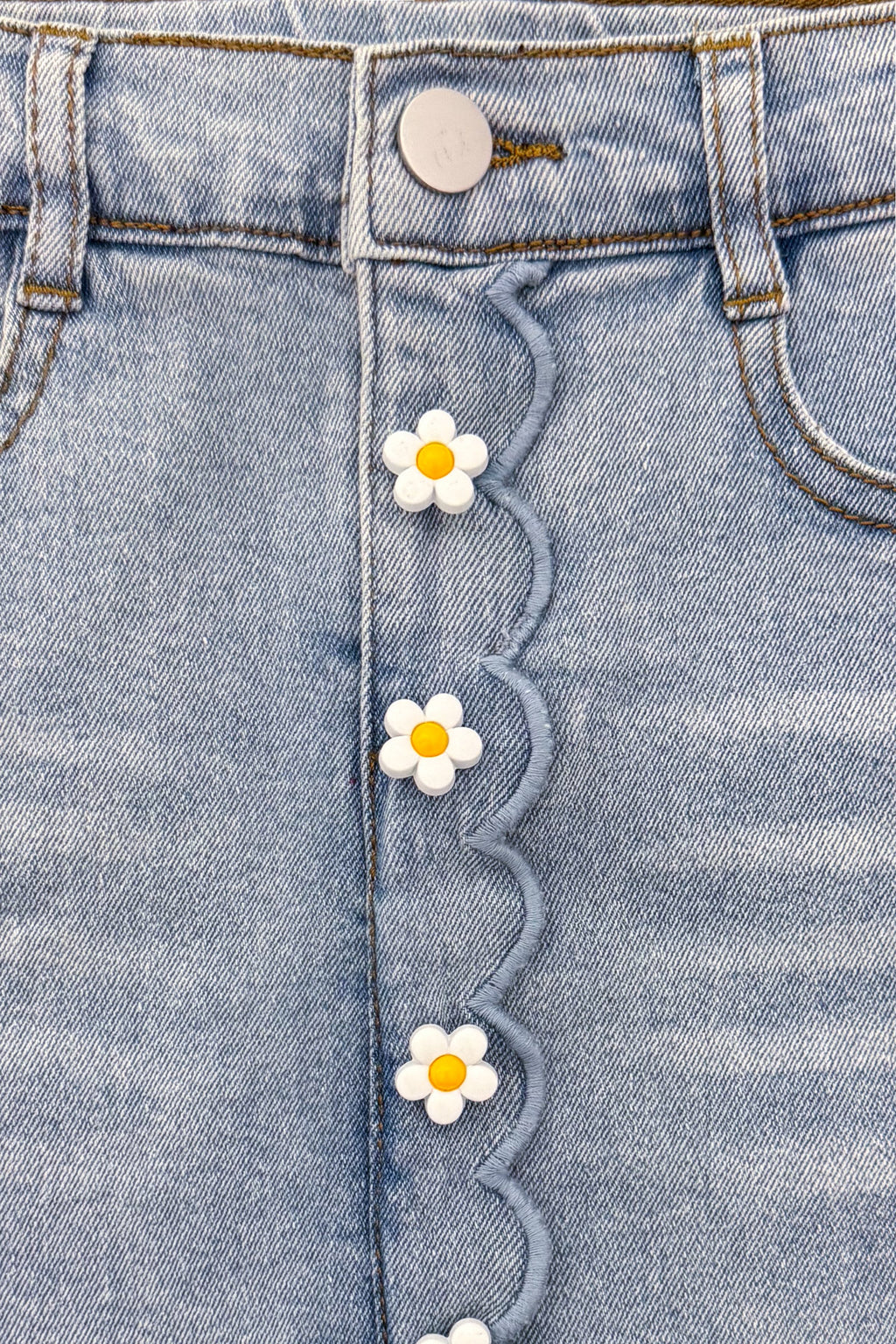 "Be The Good" Daisy Denim Skirt Set - 6-12 Months - Light blue denim skirt with scalloped edge and three white daisy buttons down front.