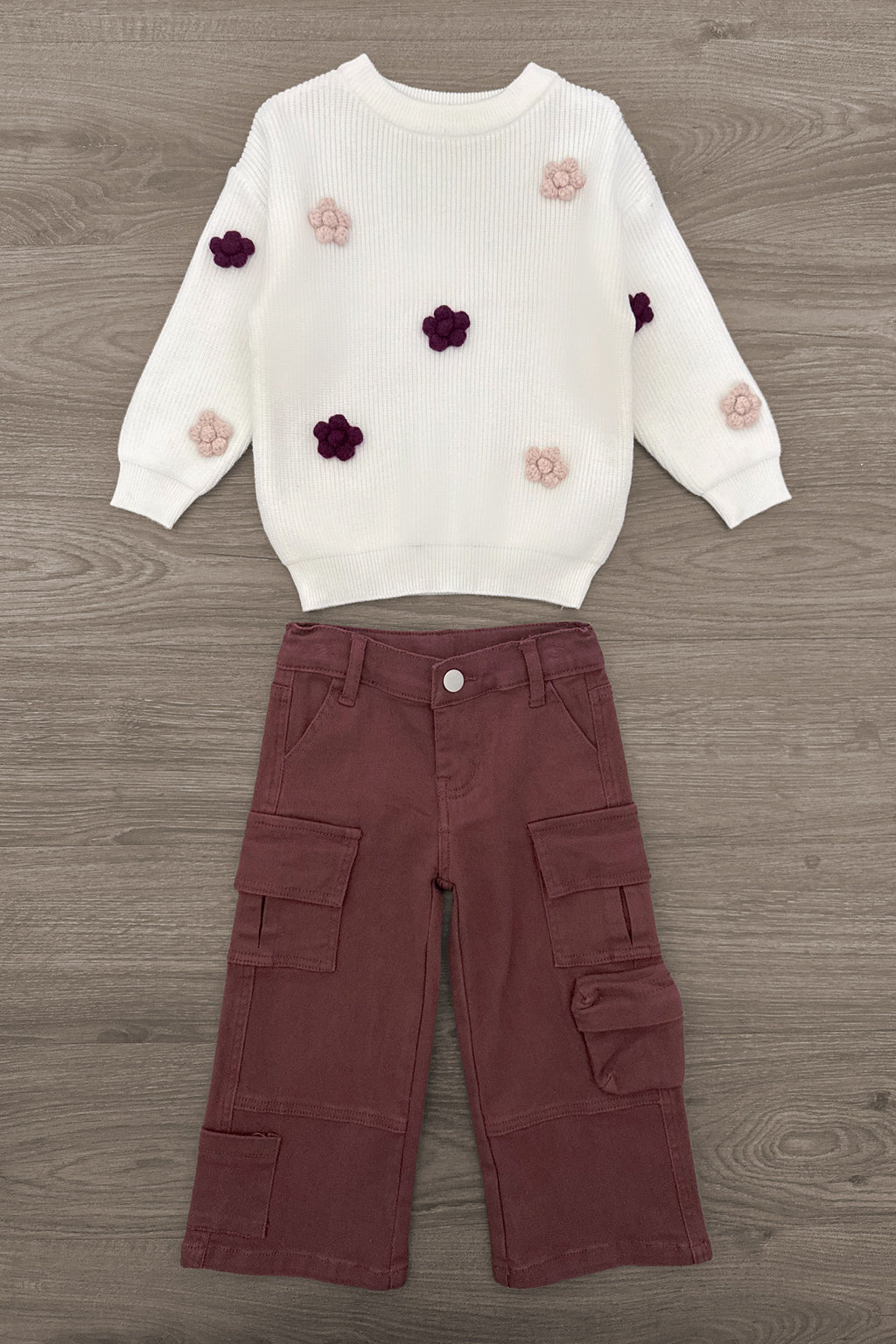 Knit Flower Burgundy Denim Pant Set - 6-12 Months - White knit sweater with purple and blush flower appliqués paired with burgundy wide-leg cargo pants.