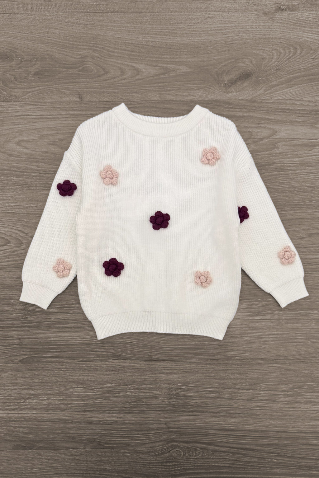 Knit Flower Burgundy Denim Pant Set - 6-12 Months - White knit long-sleeve sweater with burgundy and blush knit flower appliqués scattered on front and sleeves.