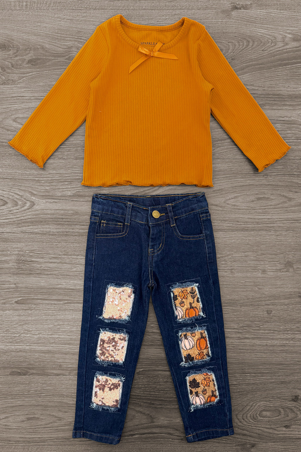Pumpkin Denim Pant Set - 6-12 Months - Orange long-sleeve ribbed top with a small bow paired with dark blue denim pants featuring square patch designs in various.