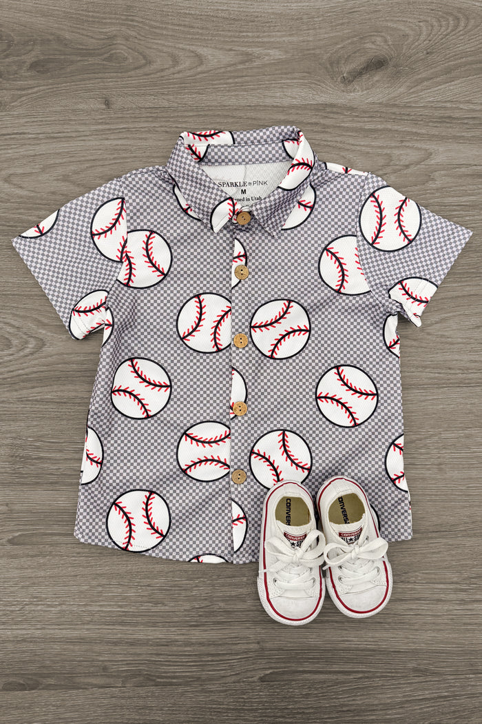 Checkered Baseball Button Down Top - 6-12 Months - Gray short-sleeve button-down shirt with small checkered print and large baseball designs paired with white toddler sneakers.