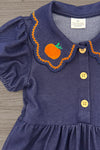 Faux Denim Pumpkin Dress - 6-12 Months - Blue faux denim dress with puff sleeves, scalloped collar embroidered with an orange pumpkin, and yellow buttons down the.