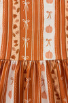 Pumpkins & Bows Stripe Dress - 6-12 Months - Orange and cream striped dress with pumpkin and bow patterns, gathered waist, lightweight fabric.